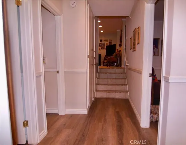 a view of a porch with furniture and a yard