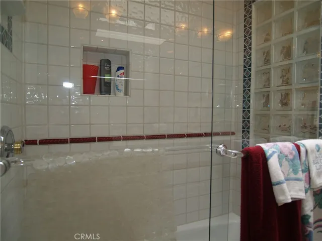 a bedroom with bed and wooden floor