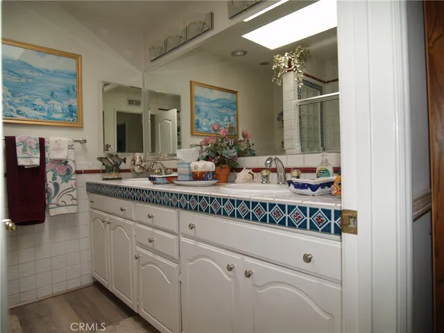 a bathroom with a sink and mirror