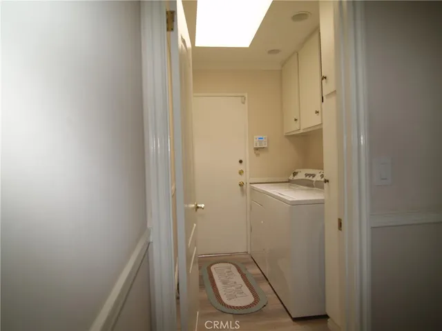 a view of house with swimming pool outdoor seating and lake view