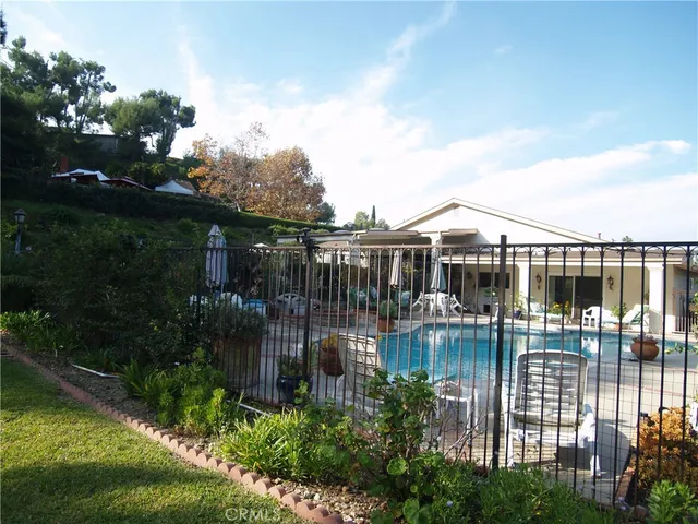 a view of a swimming pool with seating area