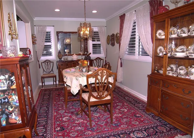 a very nice looking dining room with a table and chairs