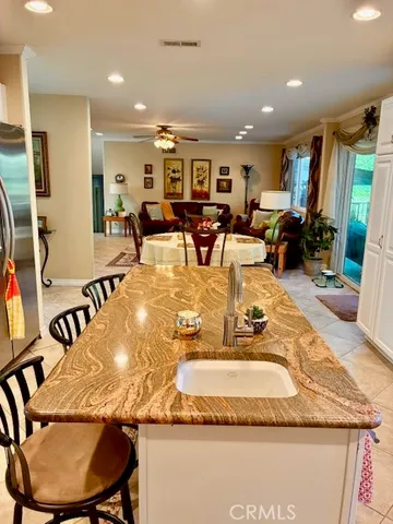 a kitchen with stainless steel appliances granite countertop a stove and a microwave