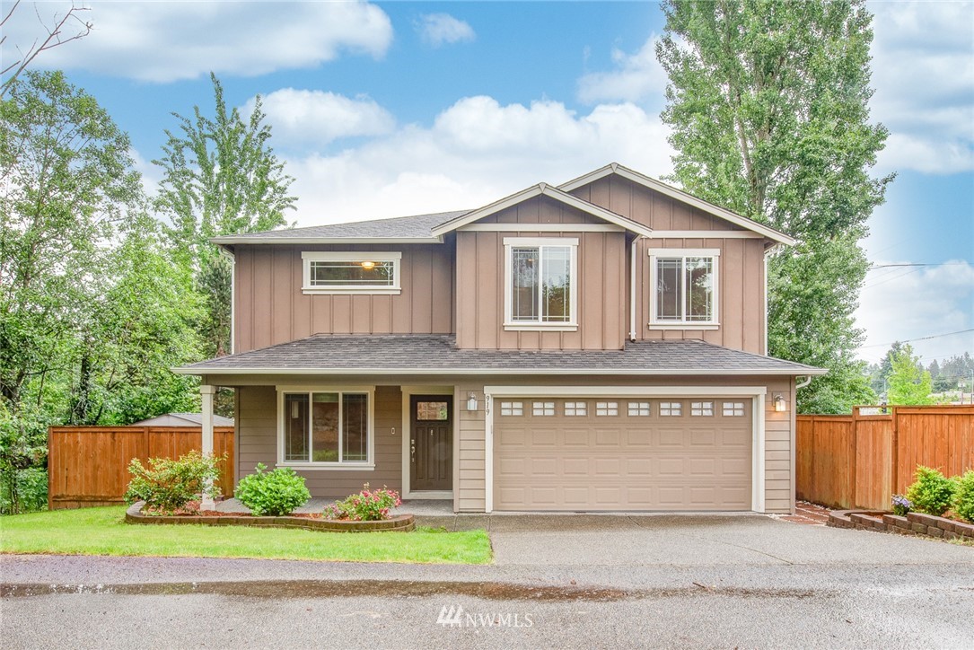 919 228th Street Southeast Bothell, WA 98021 - Photo 1 of 25 a front view of a house with garden