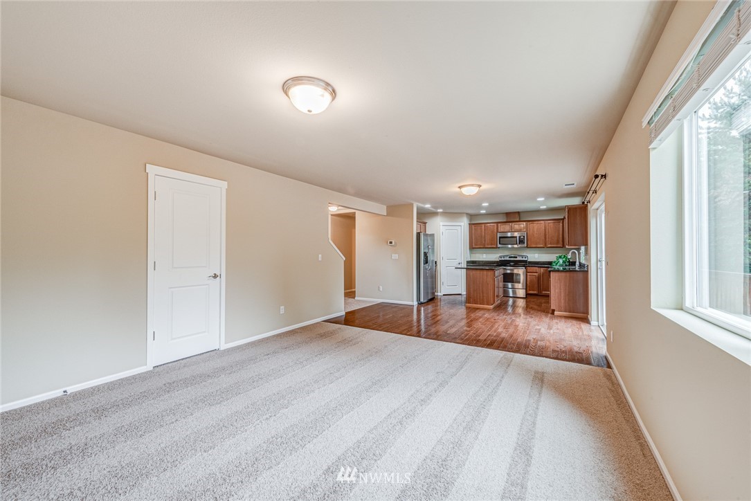 919 228th Street Southeast Bothell, WA 98021 - Photo 14 of 25 a view of a livingroom with wooden floor