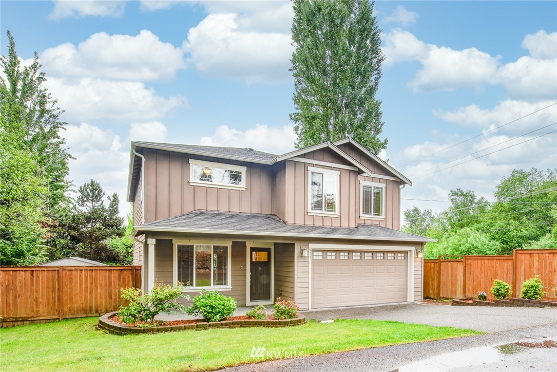 919 228th Street Southeast Bothell, WA 98021 - Photo 3 of 25 a front view of a house with garden