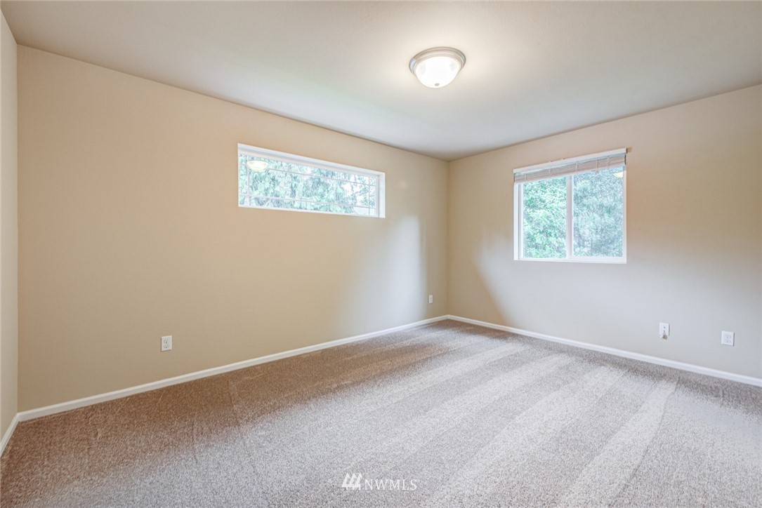 919 228th Street Southeast Bothell, WA 98021 - Photo 23 of 25 an empty room with windows