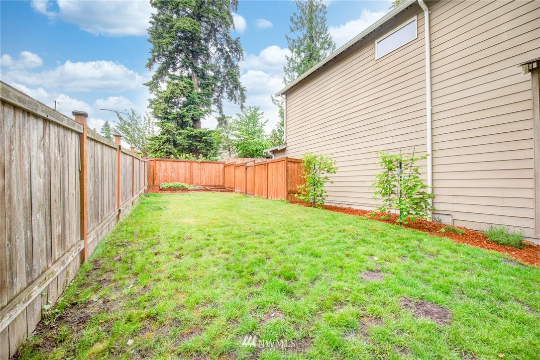 919 228th Street Southeast Bothell, WA 98021 - Photo 5 of 25 a view of a backyard with a garden