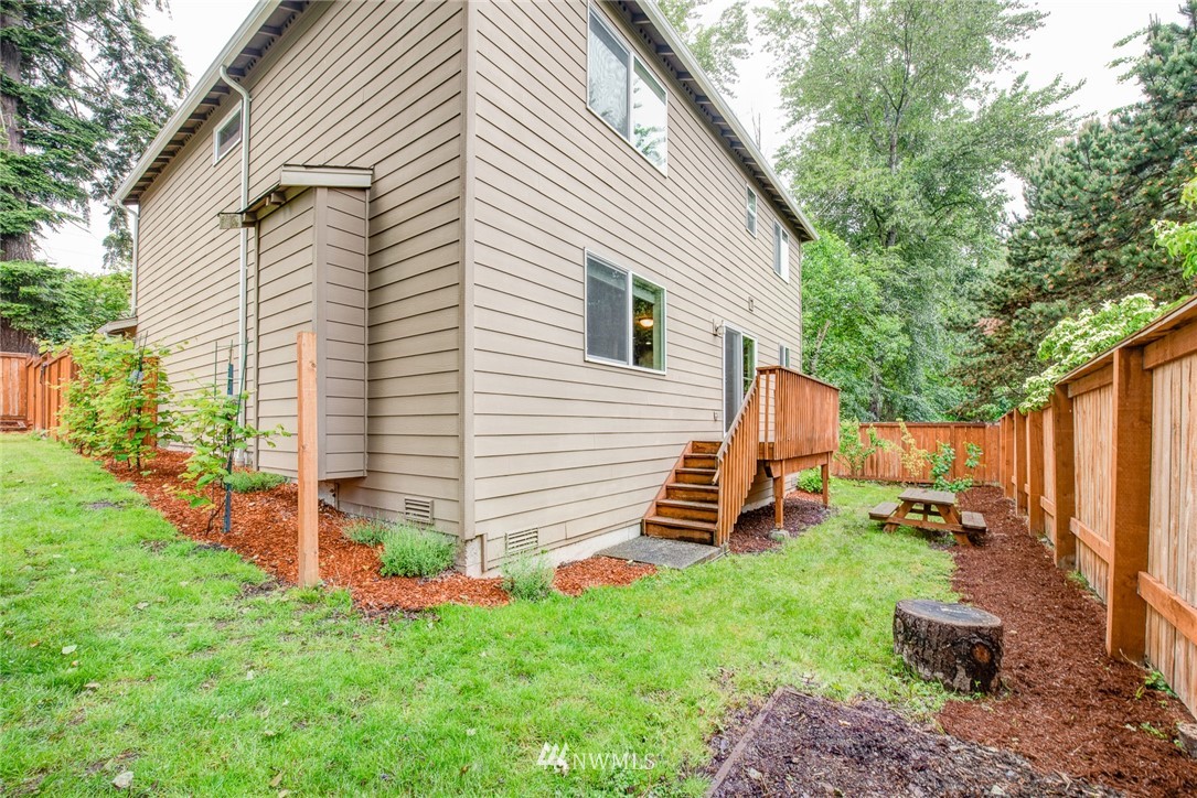 919 228th Street Southeast Bothell, WA 98021 - Photo 6 of 25 a front view of a house with a yard
