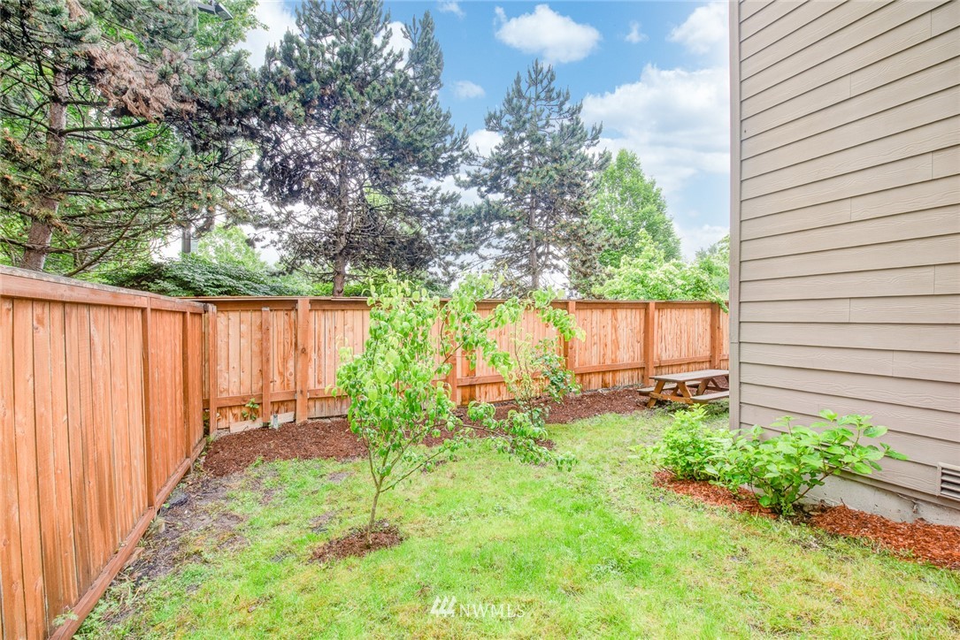 919 228th Street Southeast Bothell, WA 98021 - Photo 8 of 25 a backyard of a house with table and chairs