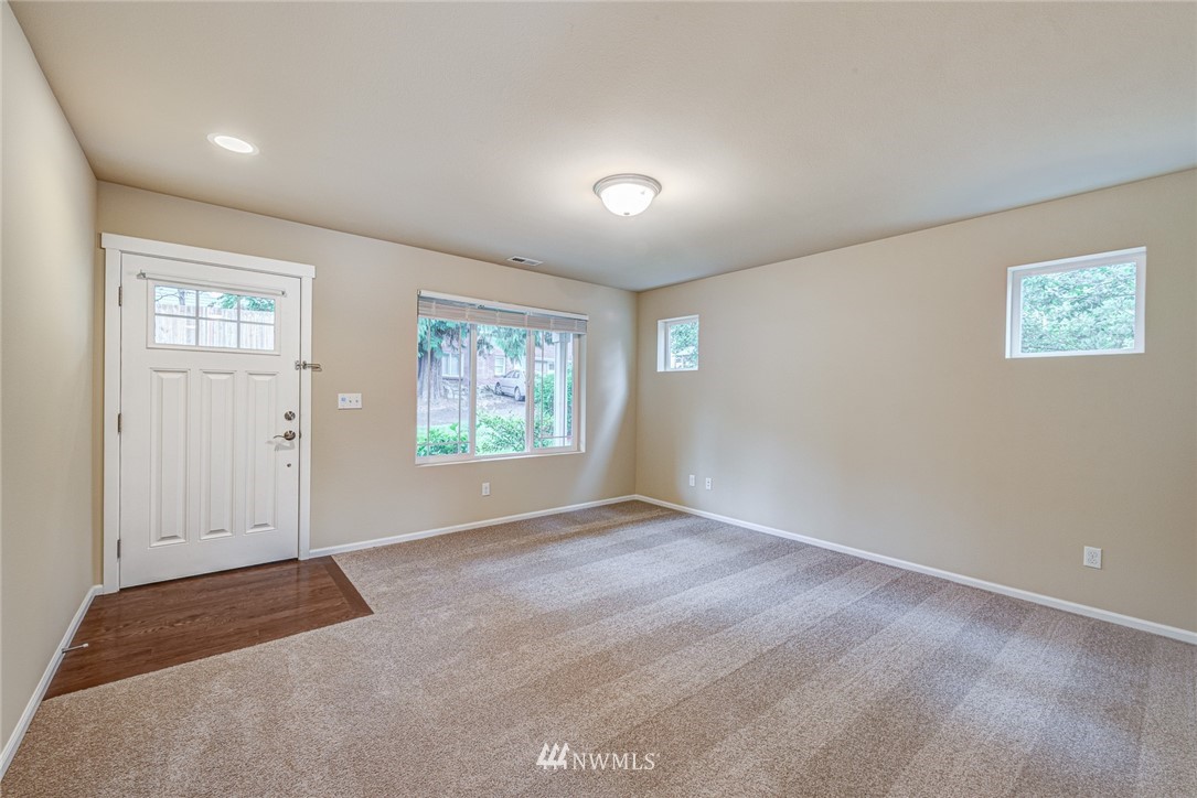 919 228th Street Southeast Bothell, WA 98021 - Photo 9 of 25 an empty room with windows