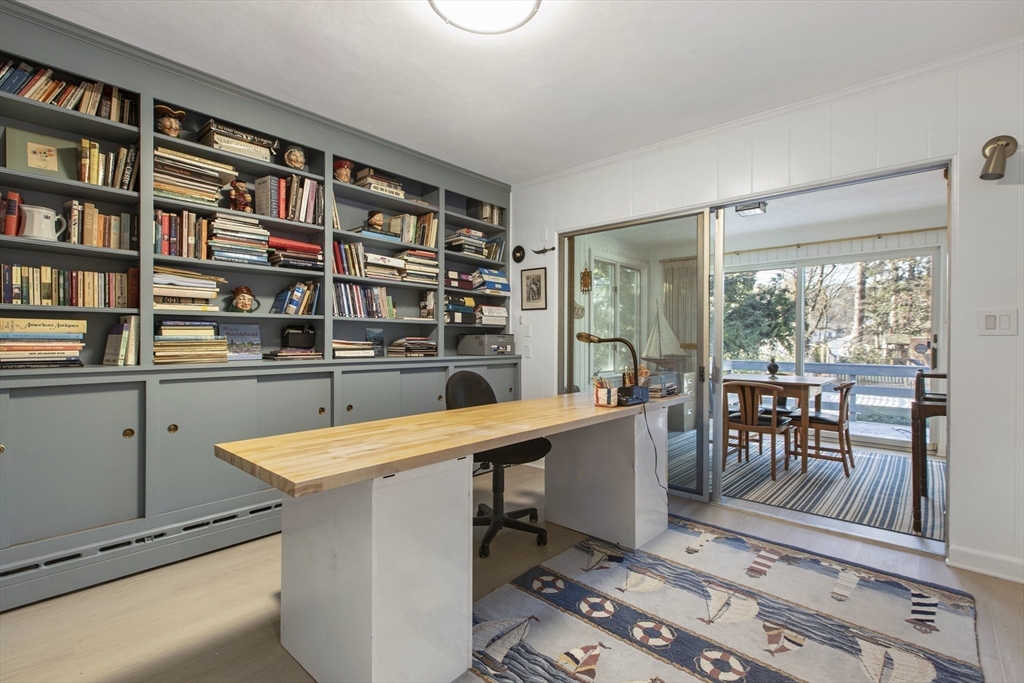 155 Paulson Road Newton, MA 02468 - Photo 12 of 33 a room with a bookshelf and a table chair