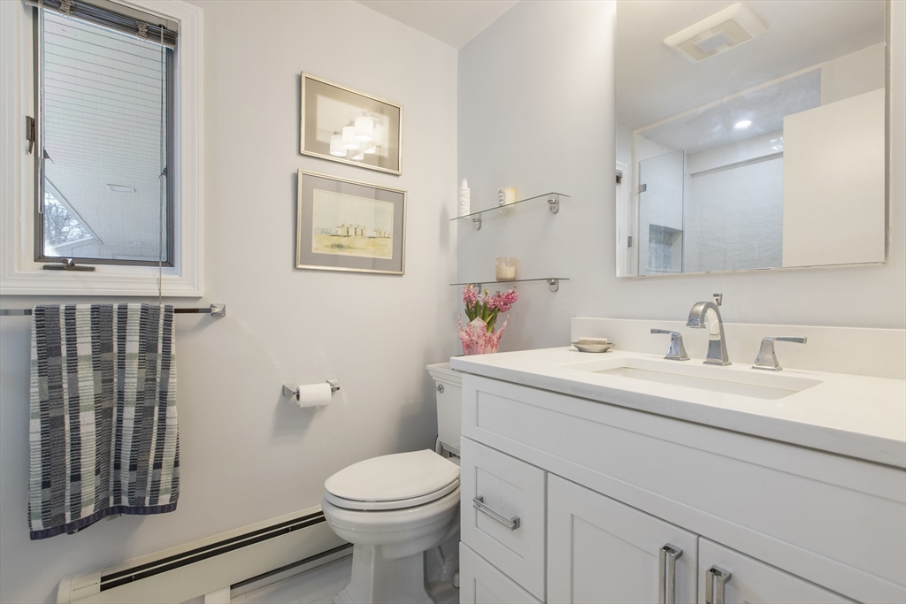 155 Paulson Road Newton, MA 02468 - Photo 16 of 33 a bathroom with a toilet a sink and mirror