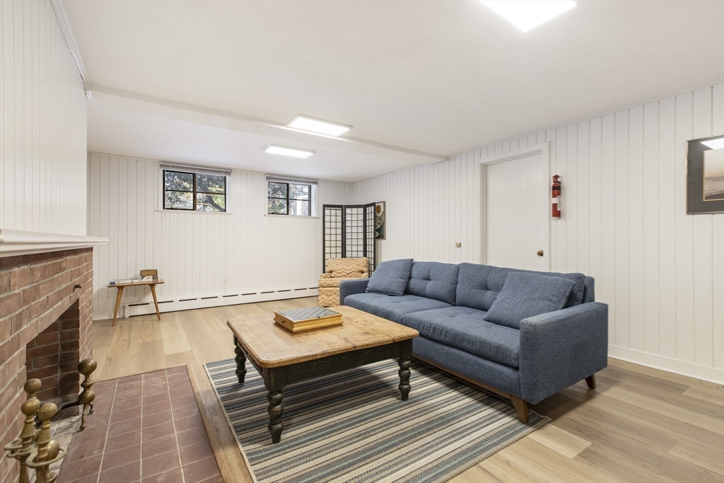 155 Paulson Road Newton, MA 02468 - Photo 27 of 33 a living room with furniture and a fireplace