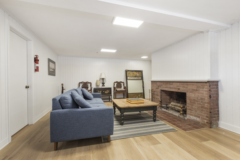 155 Paulson Road Newton, MA 02468 - Photo 29 of 33 a living room with furniture and a fireplace