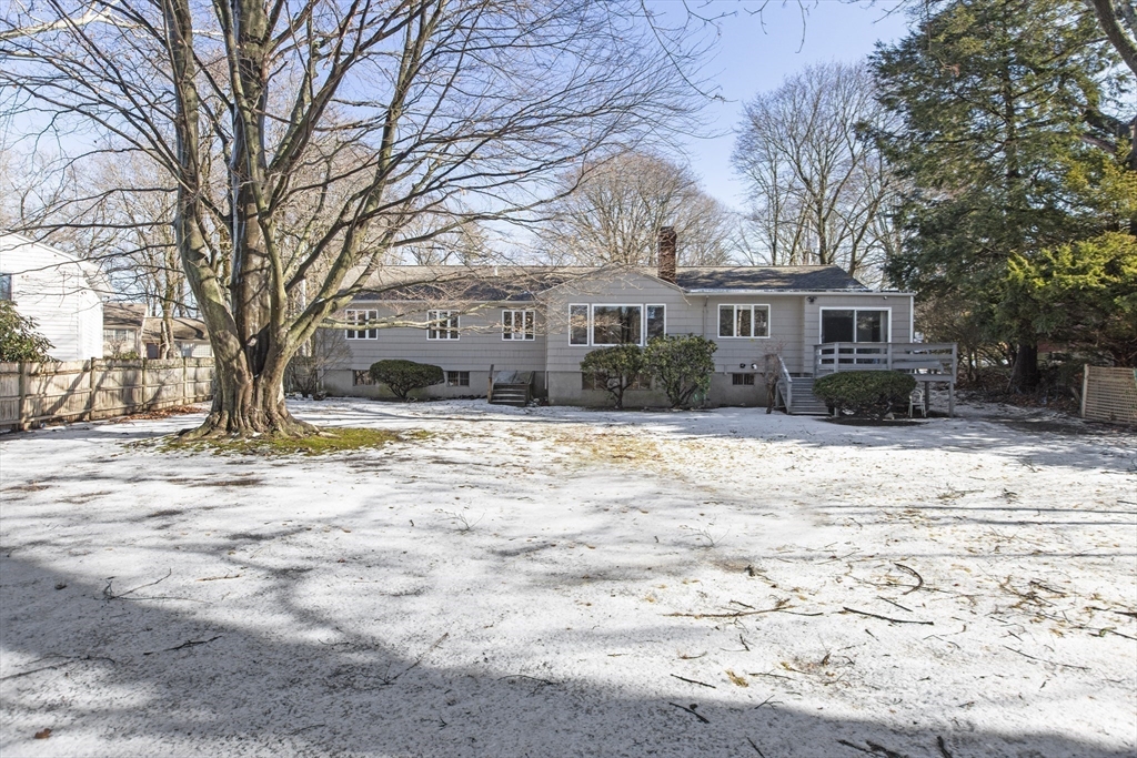 155 Paulson Road Newton, MA 02468 - Photo 31 of 33 a front view of a house with a yard covered in snow