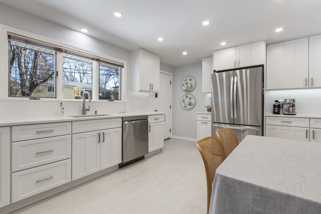 155 Paulson Road Newton, MA 02468 - Photo 4 of 33 a kitchen with white cabinets and window