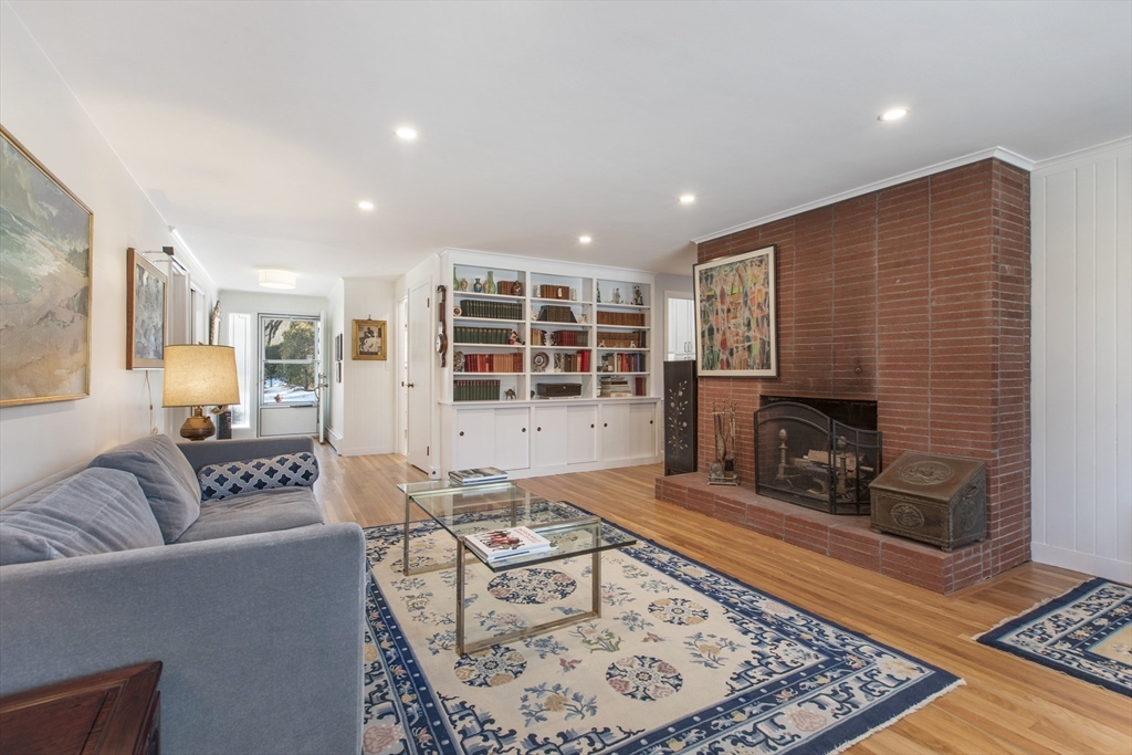 155 Paulson Road Newton, MA 02468 - Photo 6 of 33 a living room with furniture and a fireplace