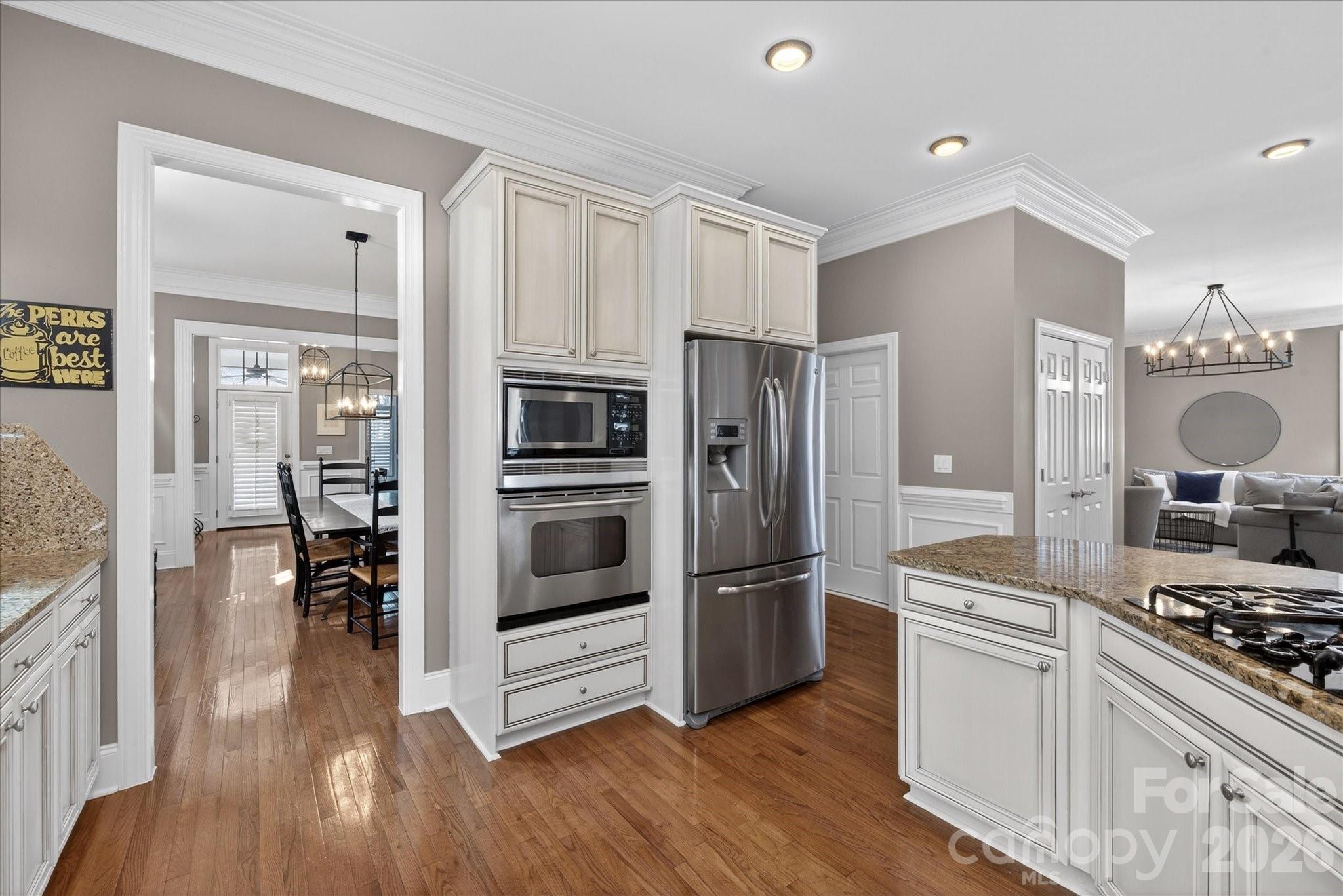 8811 1st Bloom Road Charlotte, NC 28277 - Photo 14 of 48 a kitchen with stainless steel appliances a stove a refrigerator and a refrigerator