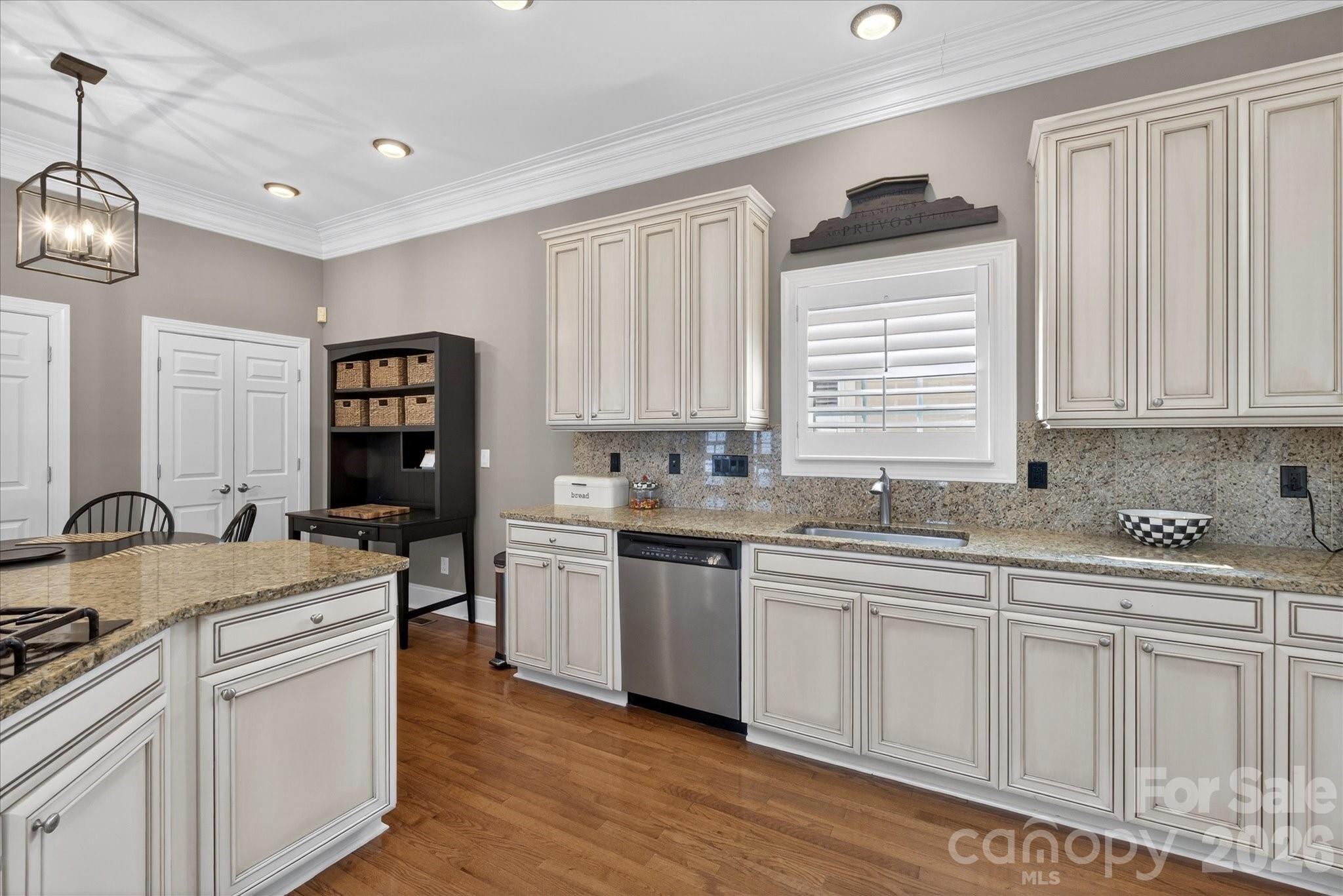 8811 1st Bloom Road Charlotte, NC 28277 - Photo 16 of 48 a kitchen with sink stove and cabinets