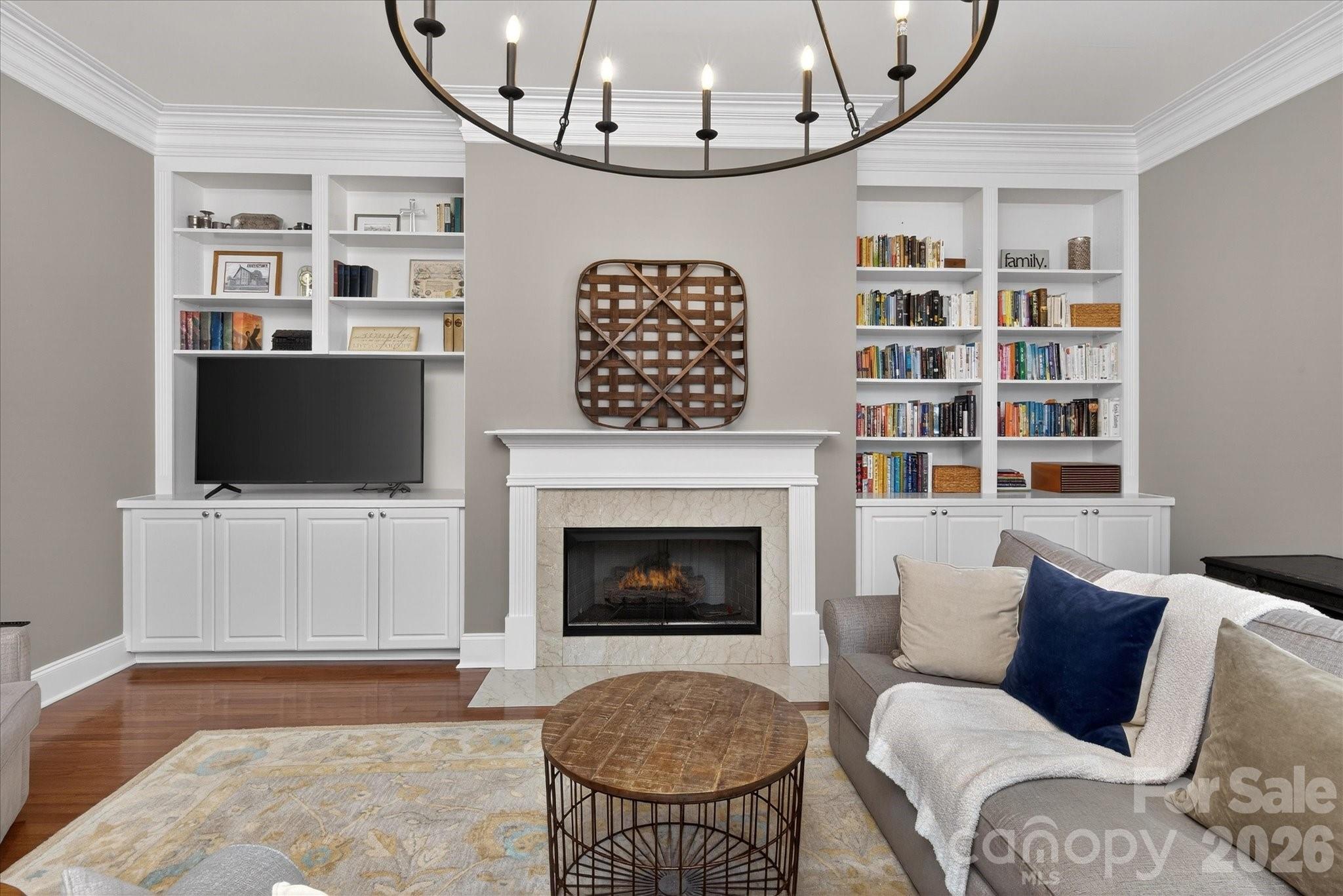 8811 1st Bloom Road Charlotte, NC 28277 - Photo 23 of 48 a living room with furniture a flat screen tv and a fireplace
