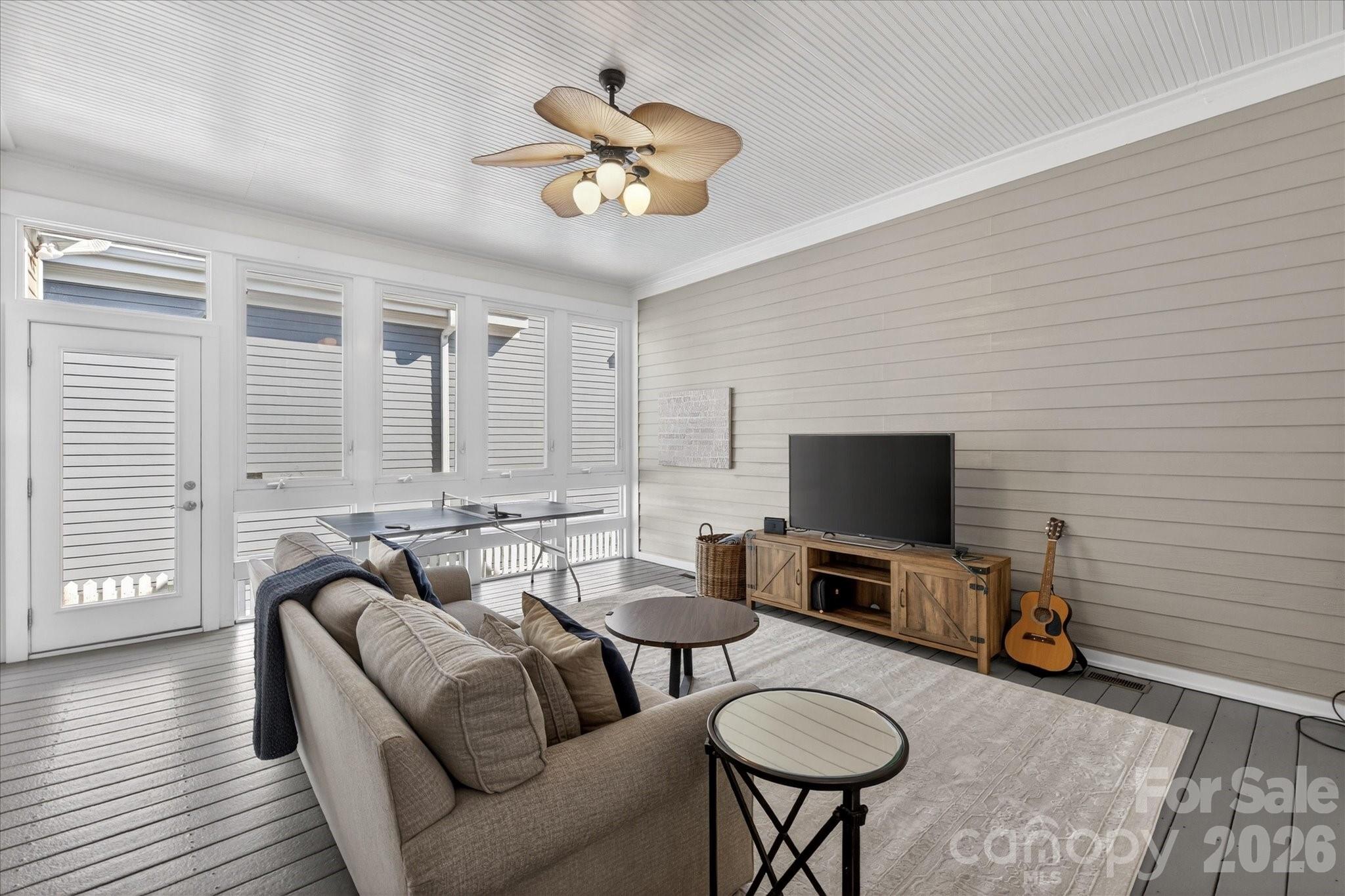8811 1st Bloom Road Charlotte, NC 28277 - Photo 26 of 48 a living room with furniture a flat screen tv and a window