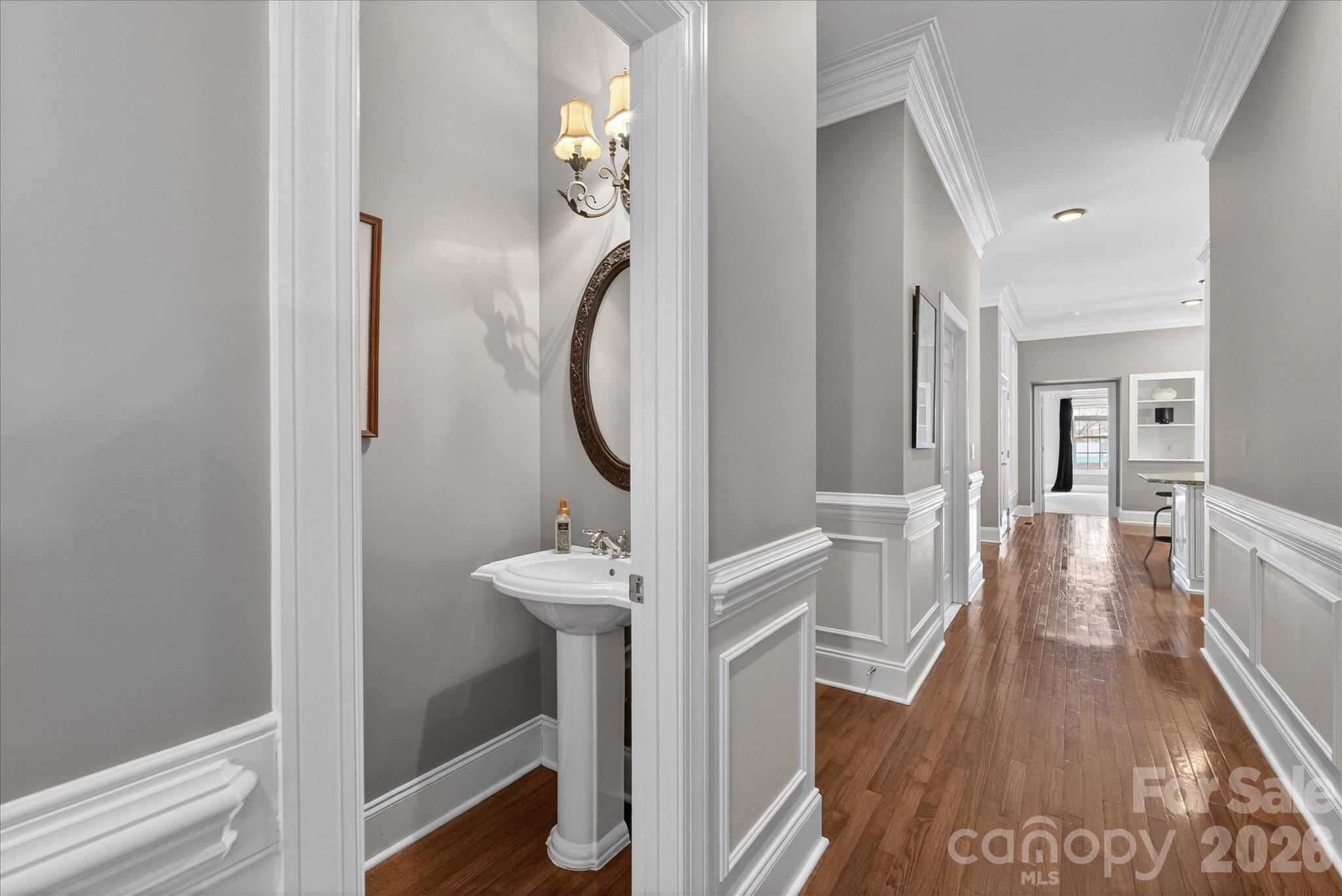 8811 1st Bloom Road Charlotte, NC 28277 - Photo 33 of 48 a view of a hallway with wooden floor and staircase