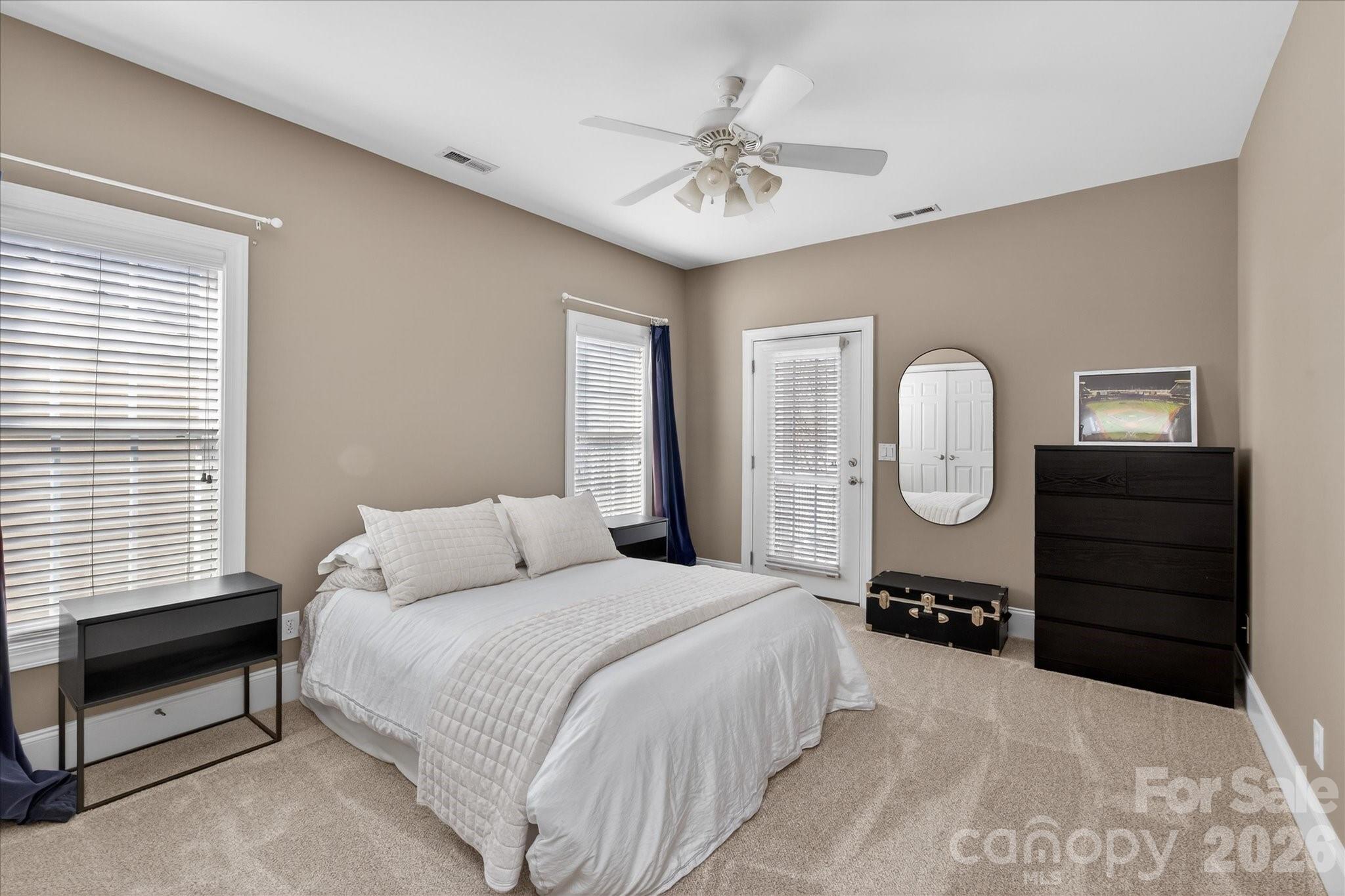 8811 1st Bloom Road Charlotte, NC 28277 - Photo 35 of 48 a bed room with a bed and dresser