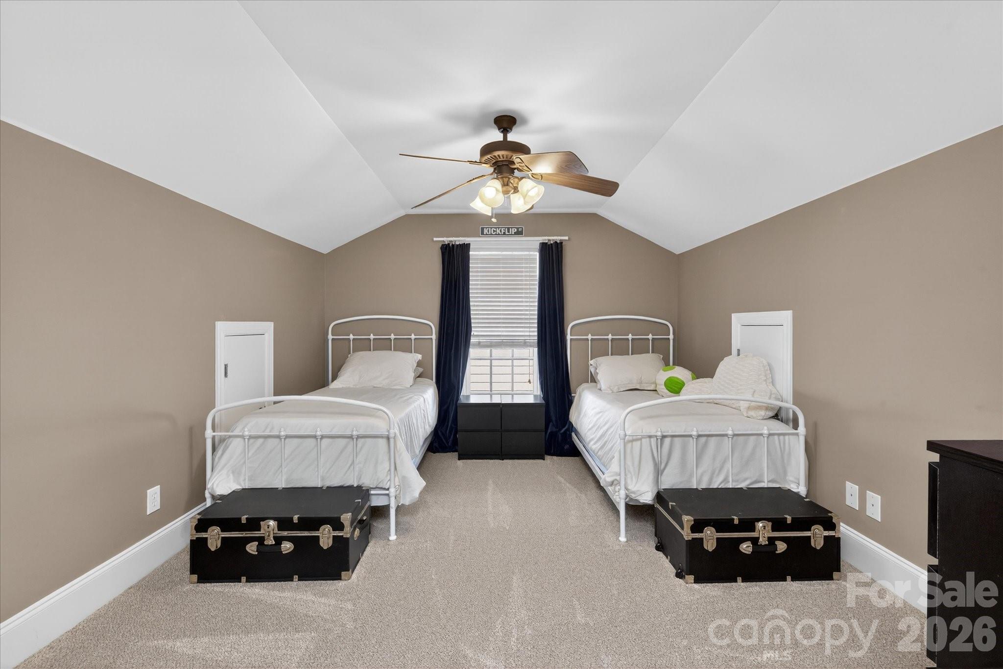 8811 1st Bloom Road Charlotte, NC 28277 - Photo 40 of 48 a living room with furniture and a chandelier