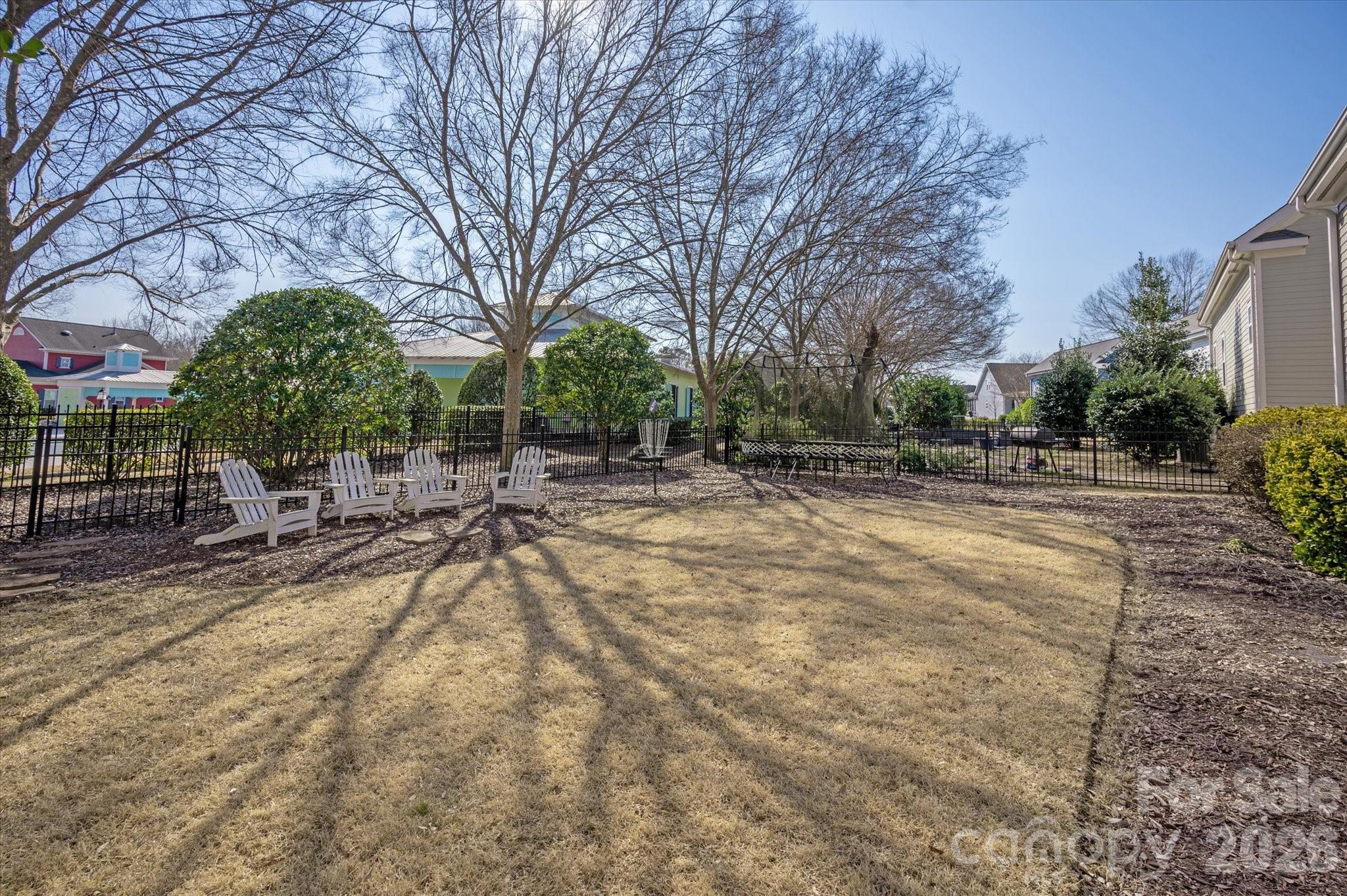 8811 1st Bloom Road Charlotte, NC 28277 - Photo 45 of 48 a swimming pool with outdoor seating and yard