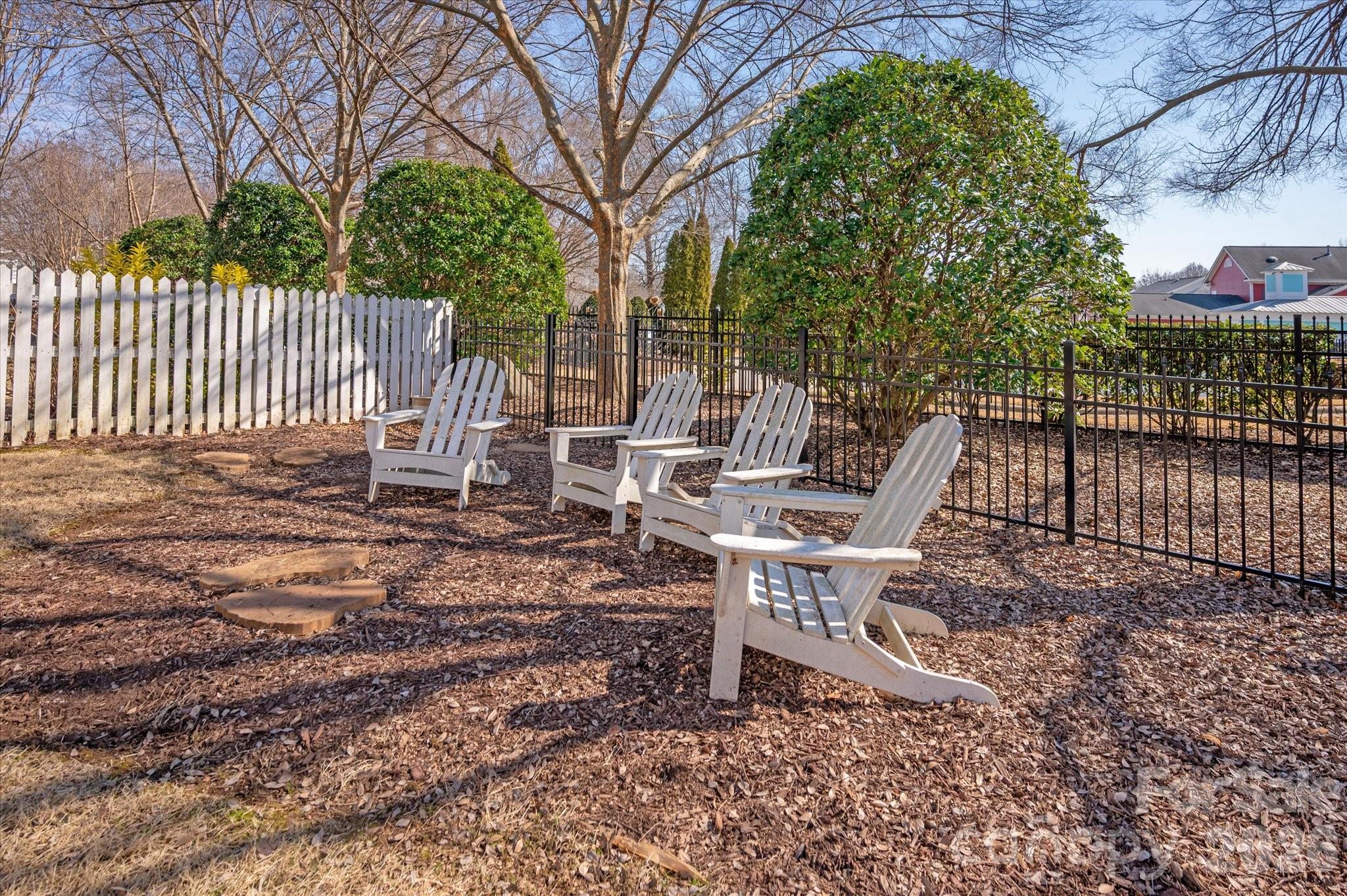 8811 1st Bloom Road Charlotte, NC 28277 - Photo 46 of 48 a view of a chairs and bench in the backyard