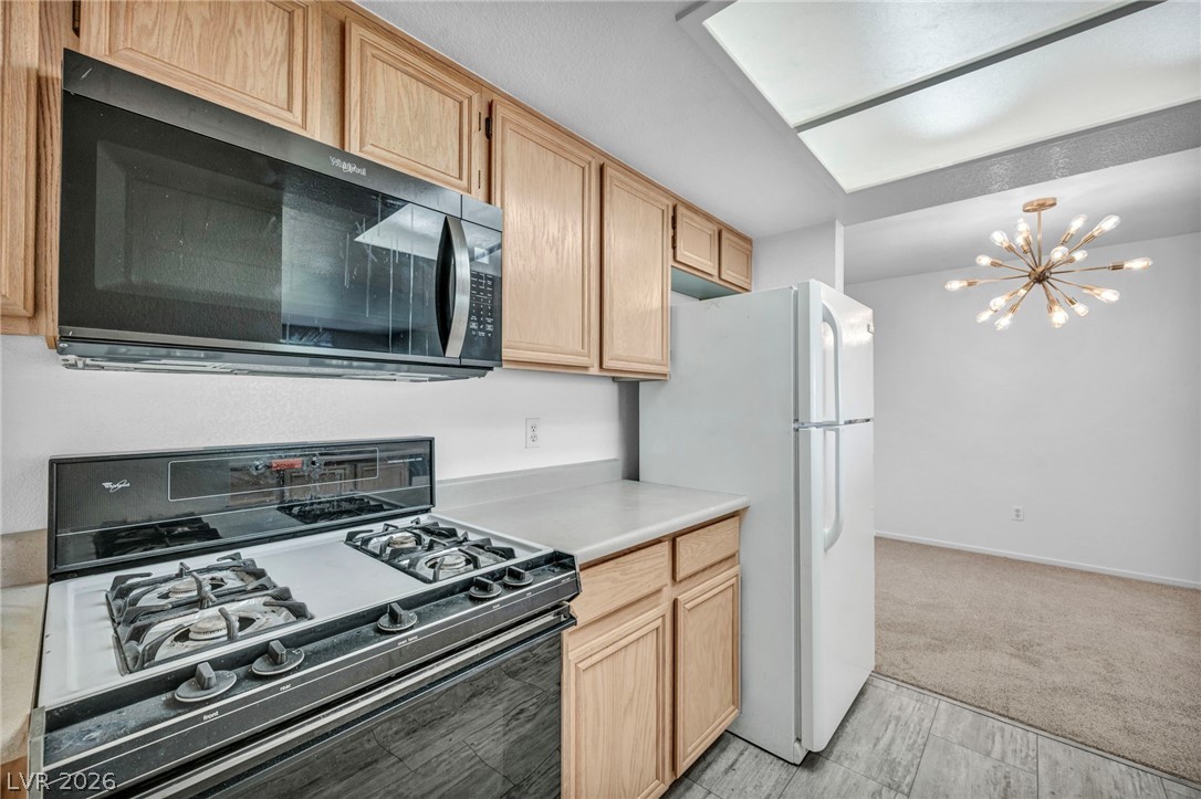 8070 West Russell Road, Unit 2060 Las Vegas, NV 89113 - Photo 6 of 47 This functional kitchen is equipped with essential appliances and ample cabinetry.