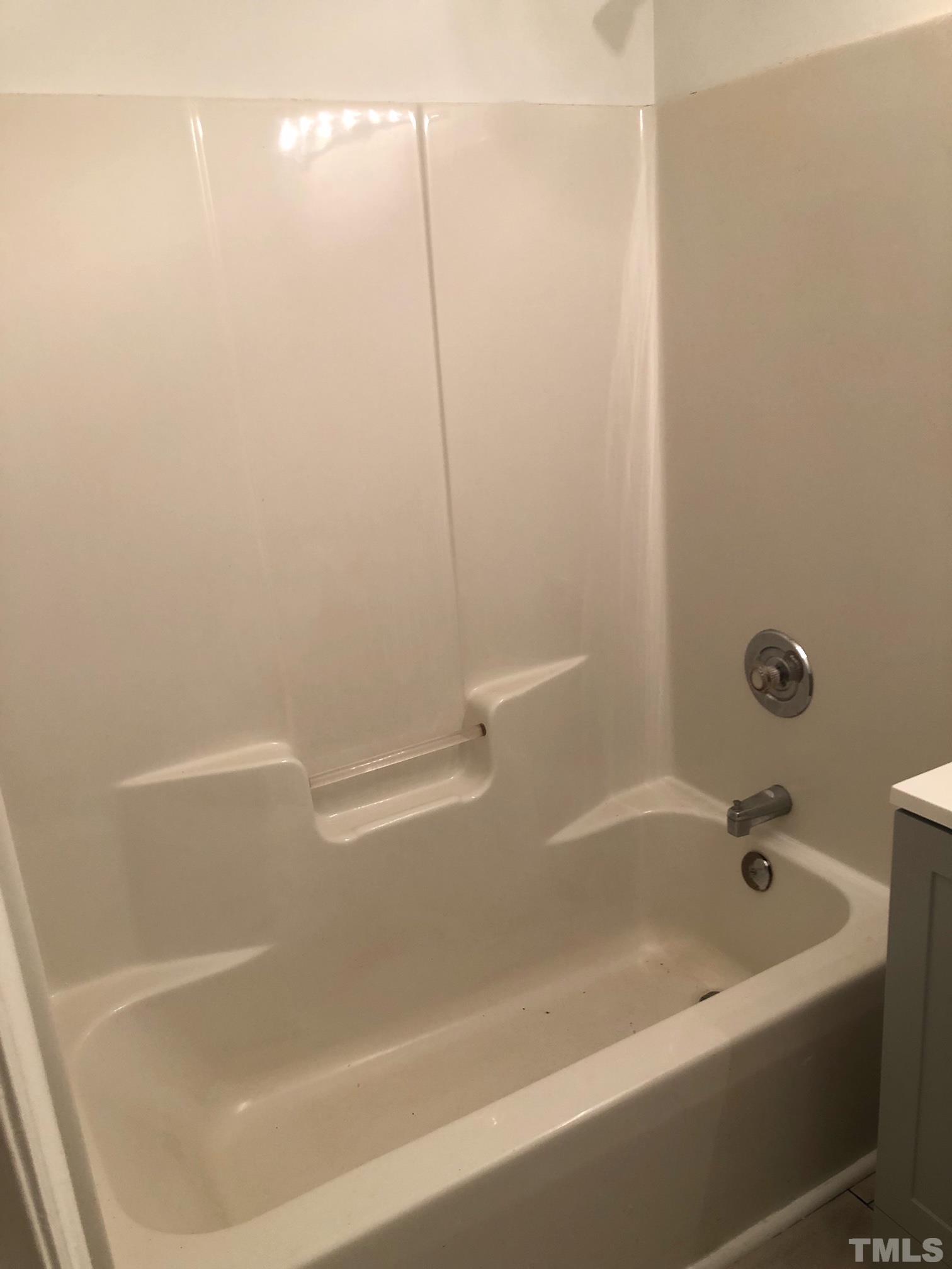 2103 Collier Road Durham, NC 27707 - Photo 20 of 23 a bathroom with a bathtub