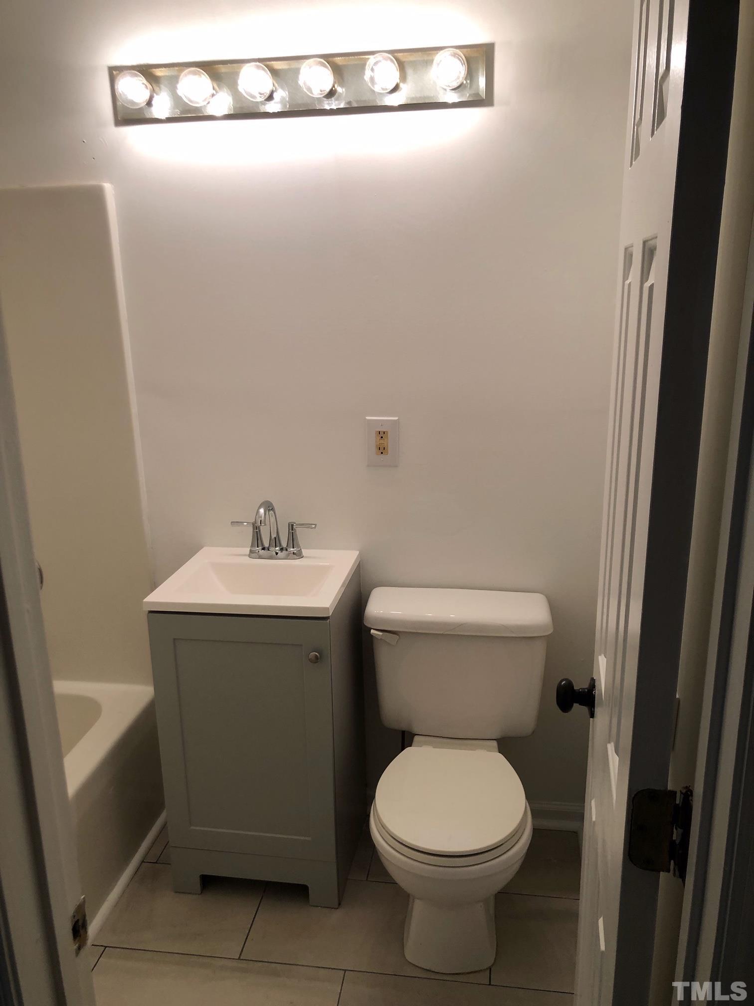 2103 Collier Road Durham, NC 27707 - Photo 21 of 23 a bathroom with a sink and a toilet