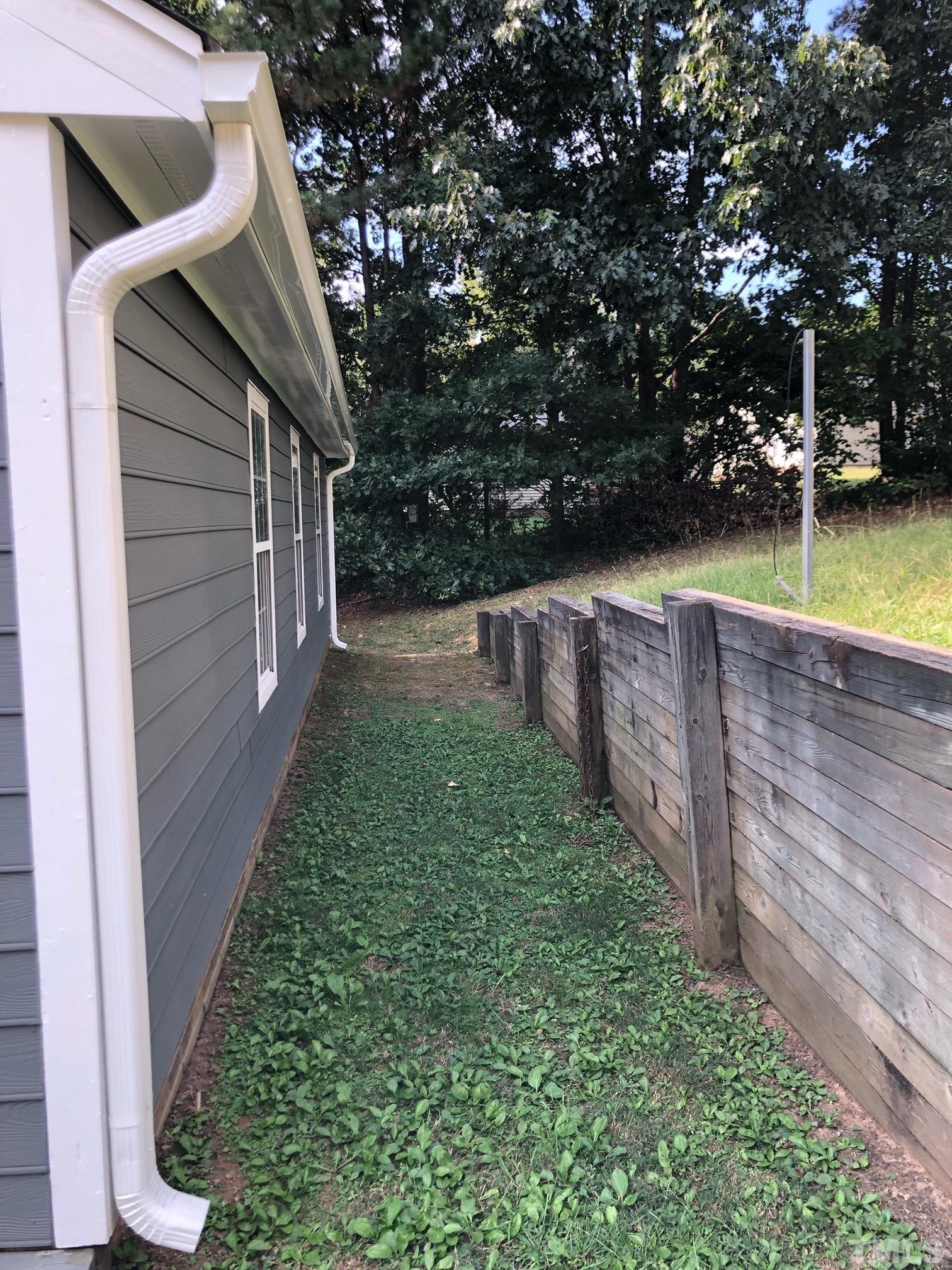 2103 Collier Road Durham, NC 27707 - Photo 22 of 23 a view of a backyard with large trees