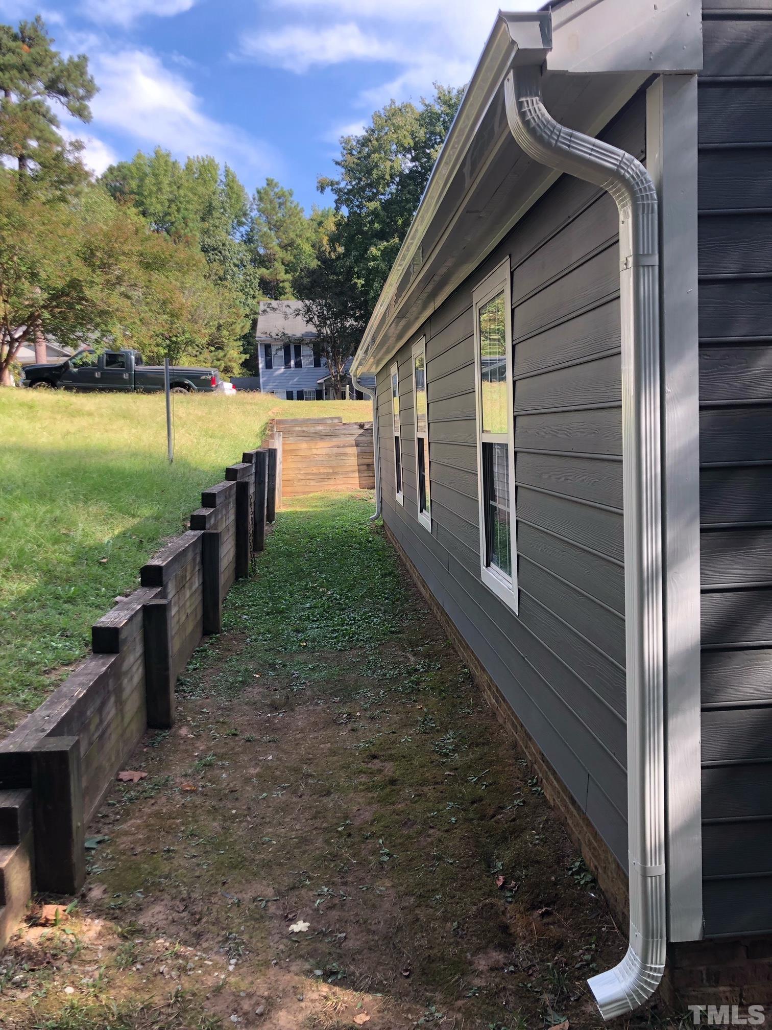 2103 Collier Road Durham, NC 27707 - Photo 23 of 23 a backyard of a house with lots of green space