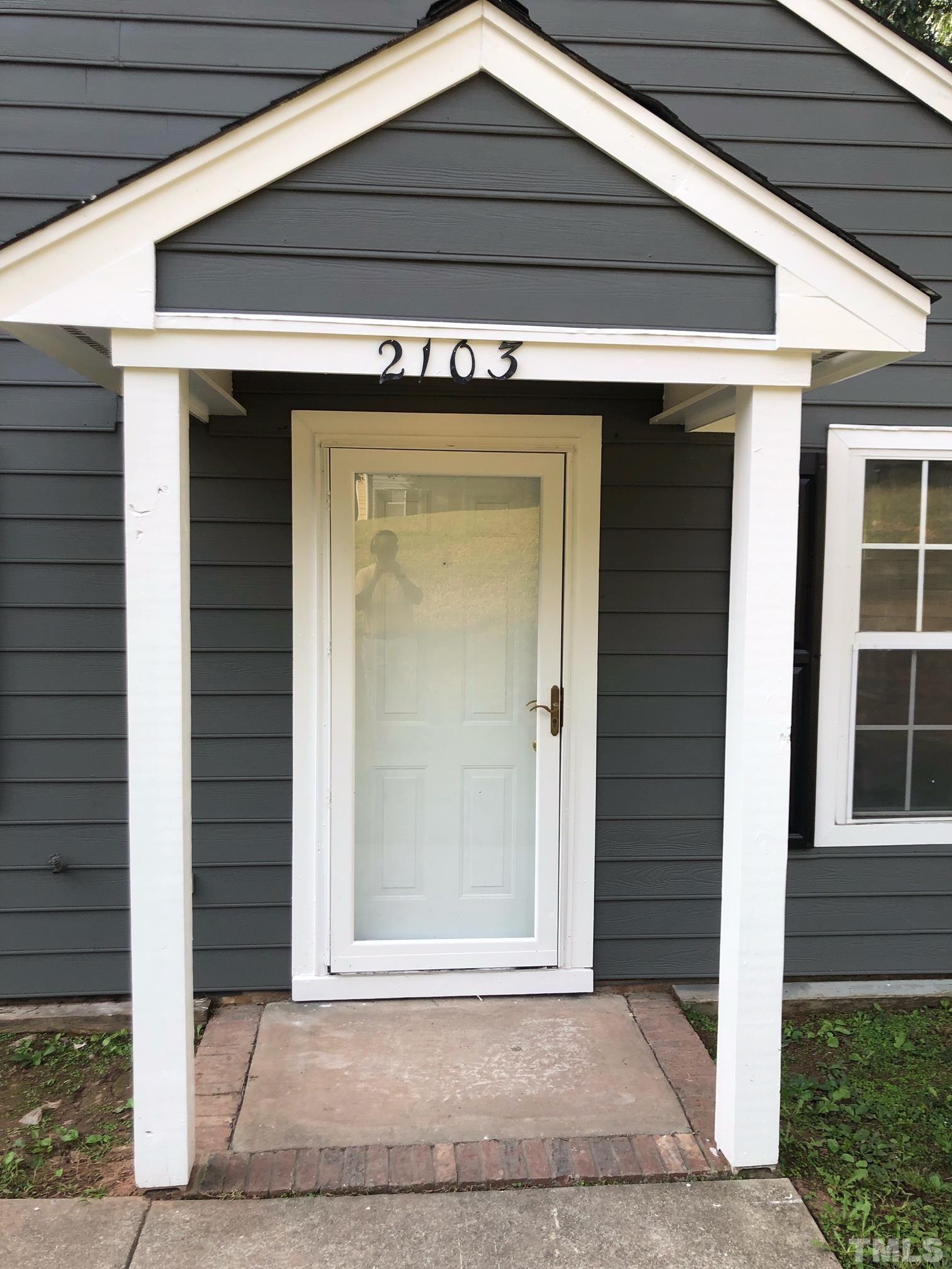 2103 Collier Road Durham, NC 27707 - Photo 5 of 23 a view of wooden door