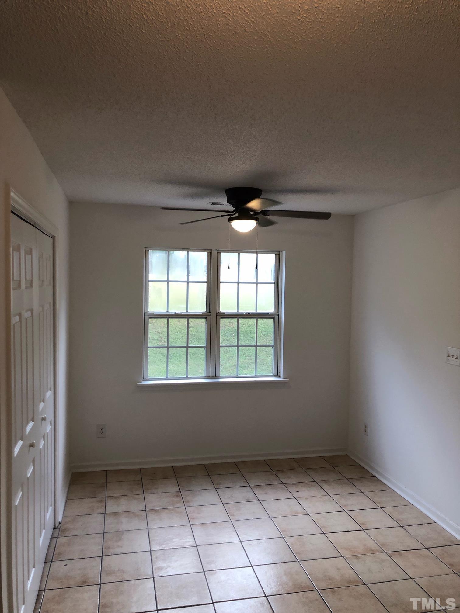 2103 Collier Road Durham, NC 27707 - Photo 7 of 23 an empty room with windows