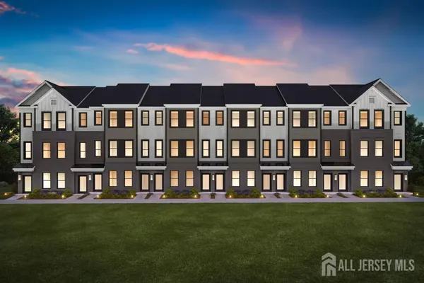 a front view of a building with a garden