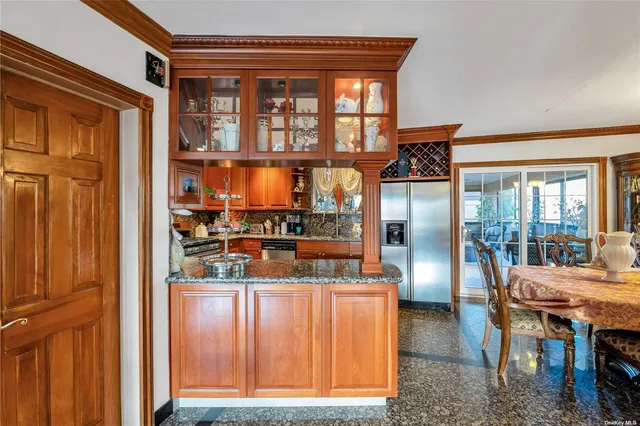 a dining room with furniture and a window