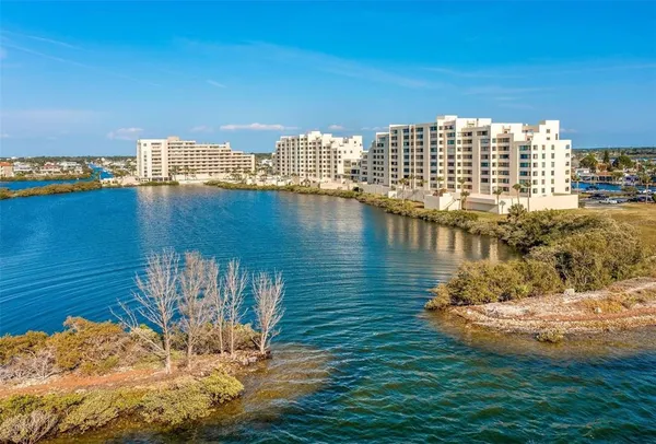 a view of a lake with tall buildings