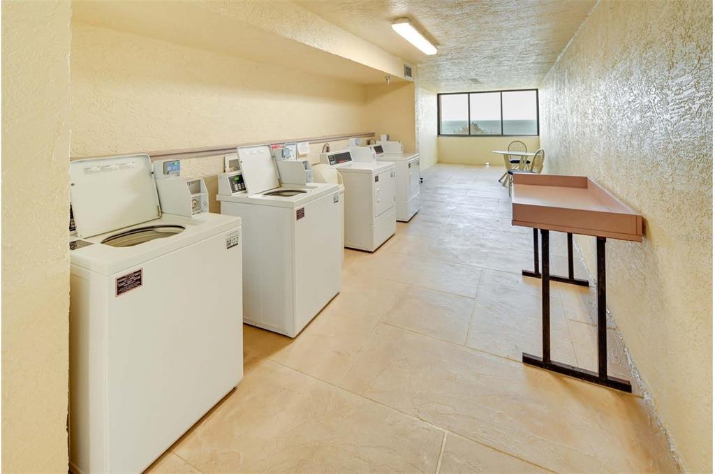 5915 Sea Ranch Drive, Unit 310 Hudson, FL 34667 - Photo 23 of 25 a view of a storage & utility room with washer and dryer