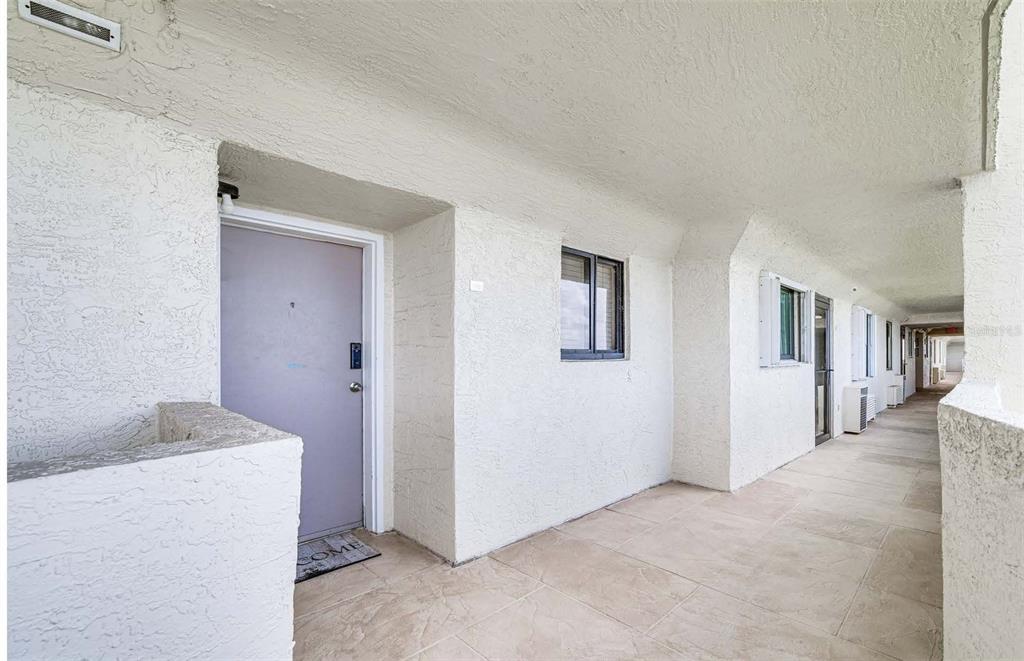 5915 Sea Ranch Drive, Unit 310 Hudson, FL 34667 - Photo 3 of 25 a view of livingroom with hardwood floor and hallway