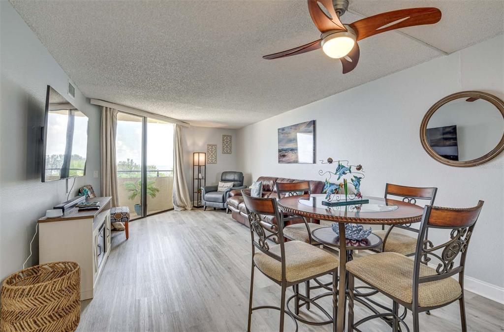 5915 Sea Ranch Drive, Unit 310 Hudson, FL 34667 - Photo 7 of 25 a view of a livingroom with furniture and a floor to ceiling window