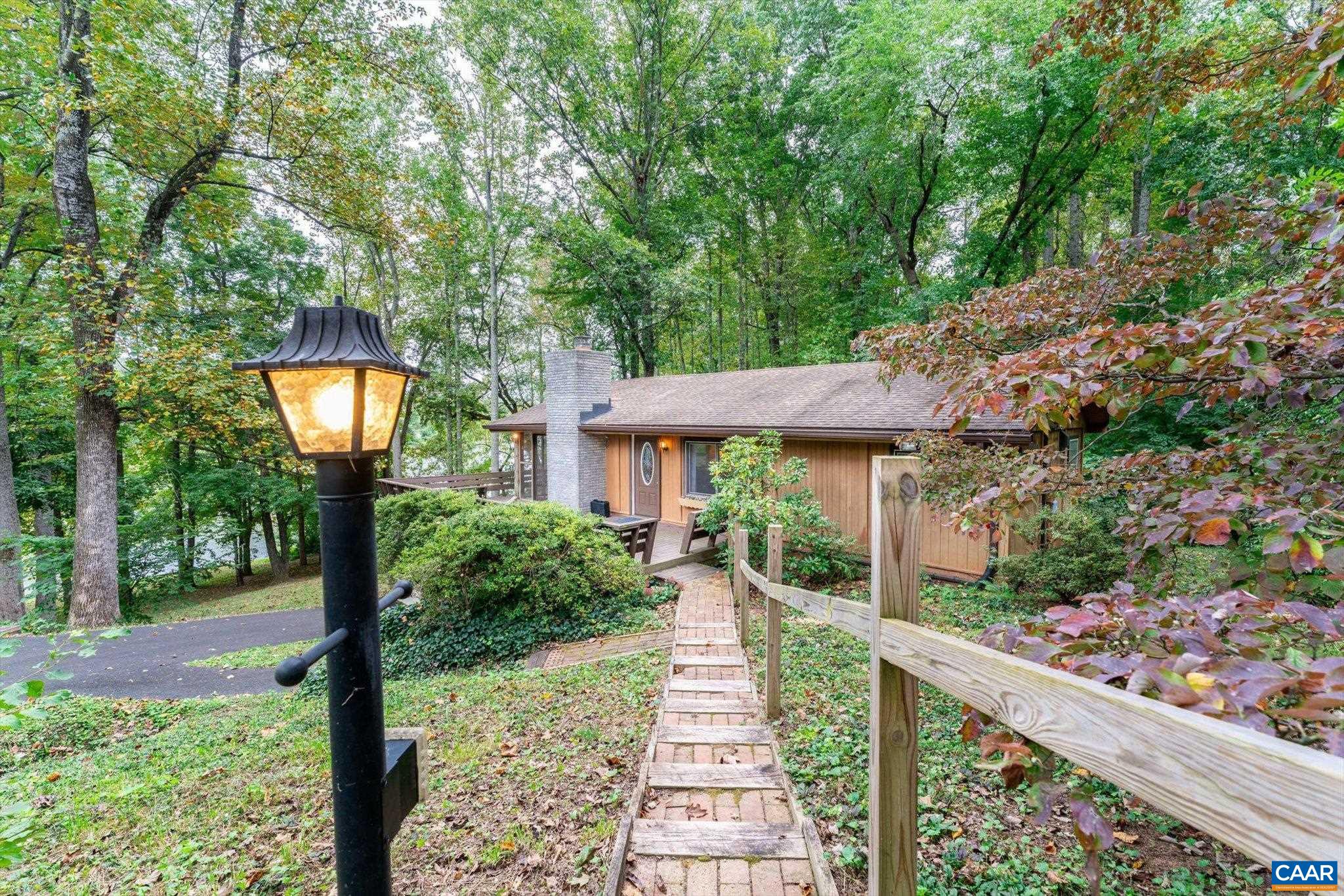 237 Westwood Road Stanardsville, VA 22973 - Photo 1 of 47 a front view of a house with garden