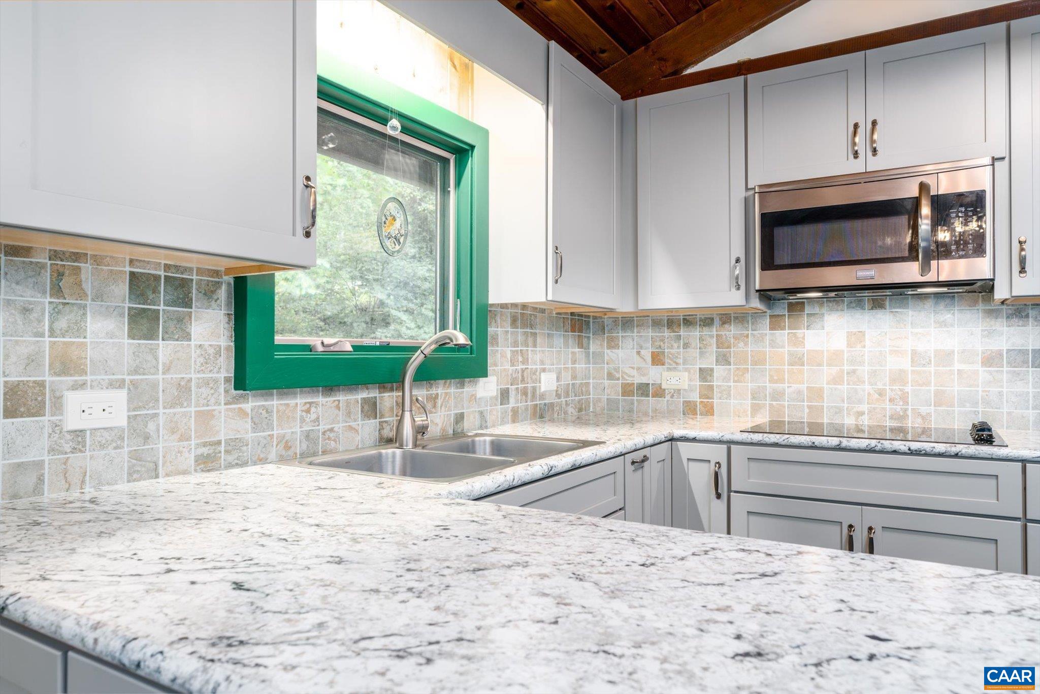 237 Westwood Road Stanardsville, VA 22973 - Photo 11 of 47 a kitchen with stainless steel appliances granite countertop a sink a stove and a microwave