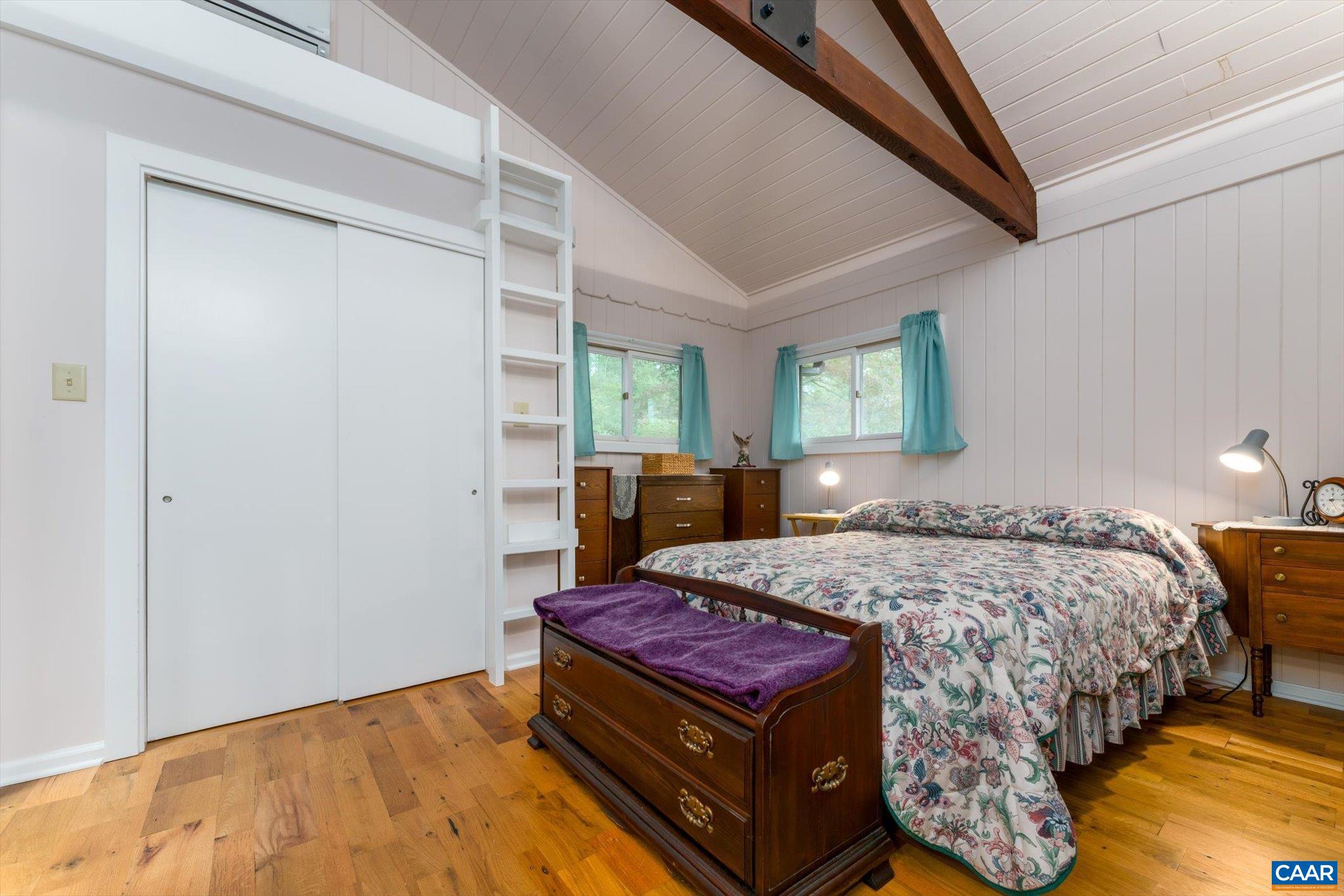 237 Westwood Road Stanardsville, VA 22973 - Photo 15 of 47 a bed sitting in a bedroom next to a window