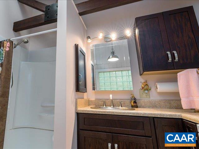 237 Westwood Road Stanardsville, VA 22973 - Photo 18 of 47 a bathroom with a granite countertop sink and a mirror