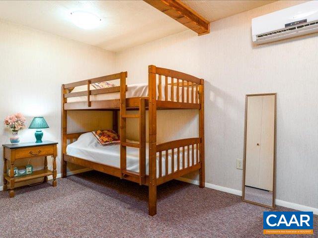 237 Westwood Road Stanardsville, VA 22973 - Photo 27 of 47 a bedroom with a bed and a baby crib