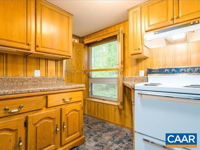 237 Westwood Road Stanardsville, VA 22973 - Photo 29 of 47 a kitchen with stainless steel appliances granite countertop a refrigerator and a stove